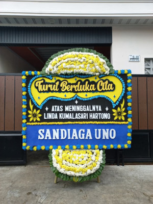 Papan Bunga Duka di Menjalin